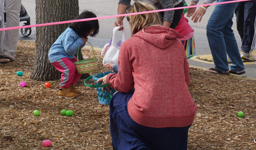 Kids hunting easter eggs.