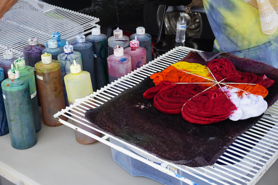 Shirts being tie dyed.